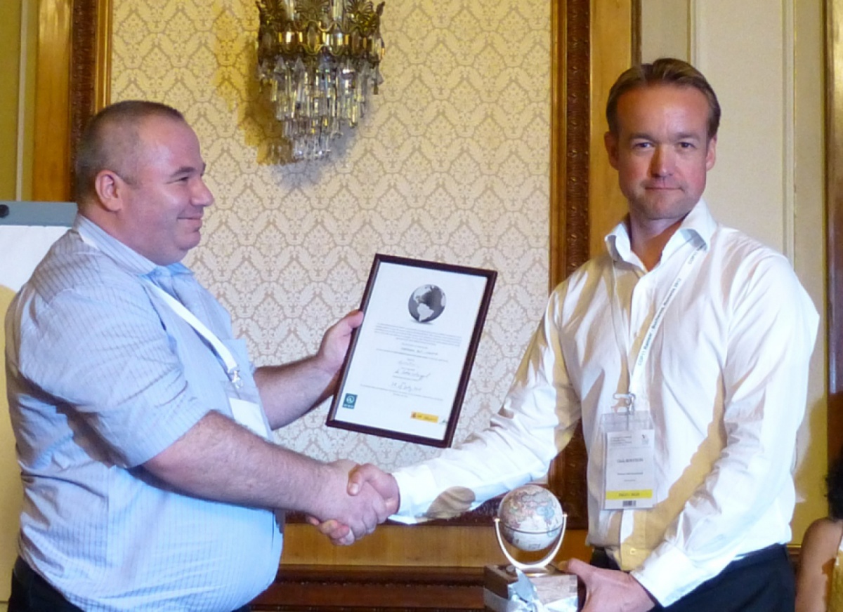 Chris Roston (WWN) handing over the Grey Globe to Croatia